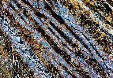 Komatiit-Lava Komatiite sind charakteristisch für das Archaikum. Es handelt sich um einen Lava-Typ, der im Vergleich zu modernen Basalt-Laven sehr reich an Magnesium ist.