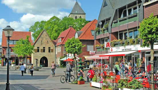 Havixbecker Gemeindeportrait Marktplatz Havixbeck Many big and small buildings made of Baumberger Sandstone, the typical bright-yellow building material for this region, shape the outlook of the