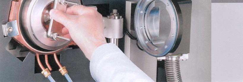 Placement of sample and sample holder closed sample chamber
