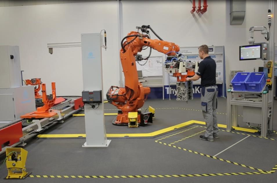 Beispiel Montagestation Konzept Sichere und dynamische Positionsüberwachung von Roboter und Werker, um einen Kontakt zu verhindern Prozess Montage eines Dichtbleches an der