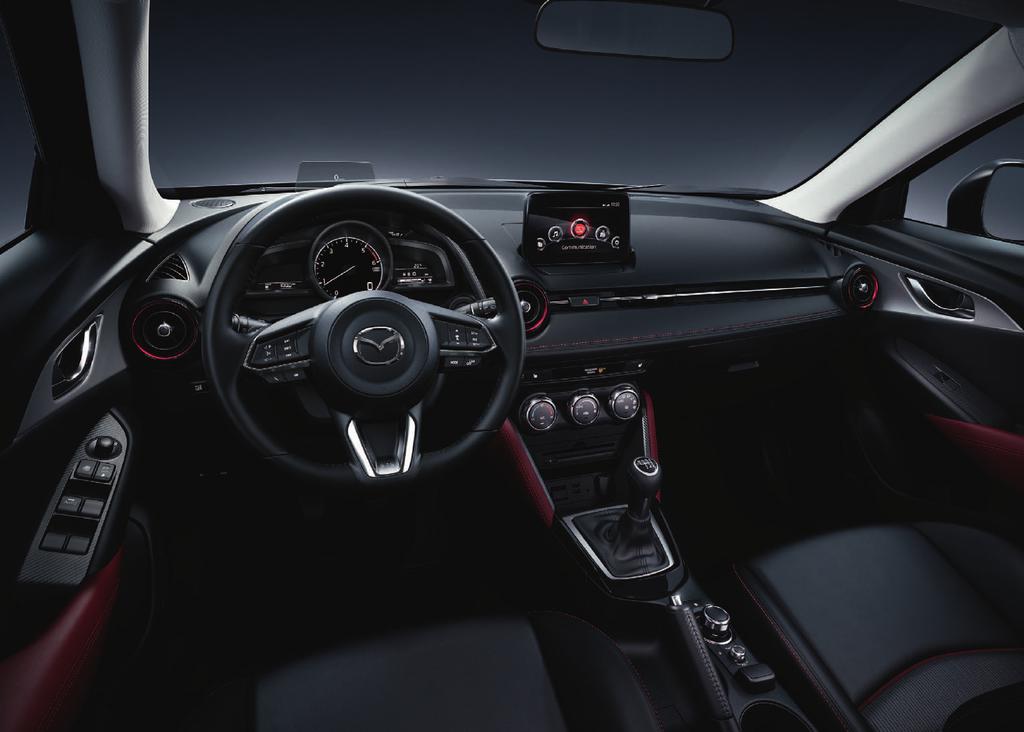 Die Abbildung zeigt einen Mazda CX-3 Sports-Line mit werkseitig optionalem Technik-Paket.