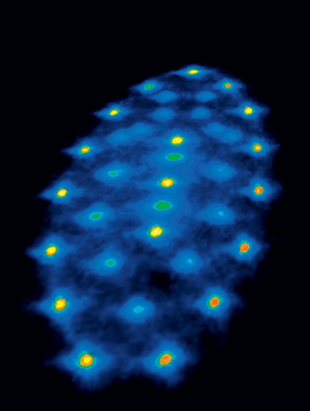 Vielversprechende Kandidaten für Qubits: Ionen, die in einer elektrischen Falle fixiert sind und hier als helle Punkte