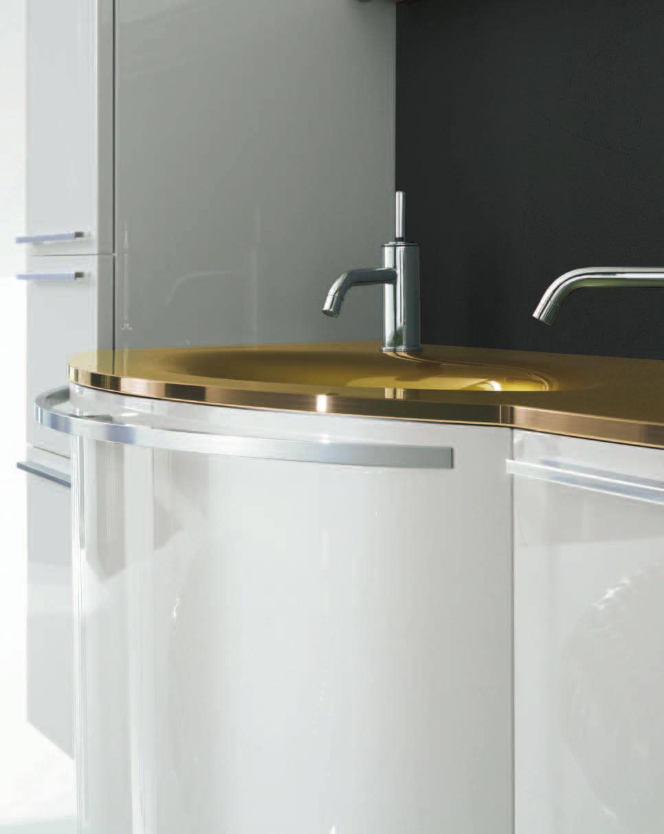 This interesting washbasin base unit has Brill finish handles that not only underscore the curve but can be used as