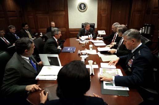 On Friday morning, March 21, 2003, President George W. Bush meets with his war council in the Situation Room of the White House.
