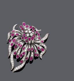 Each set with 1 oval, treated ruby totalling ca. 5.20 ct, surrounded by diamonds and a frame of marquise- and brilliant-cut diamonds weighing ca. 2.60 ct.