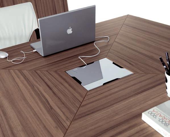 The square meeting table with compound worktops and relative storage units are in walnut melamined finish. Usable and aesthetically effective is the chromed central lid with slots for cables exit.
