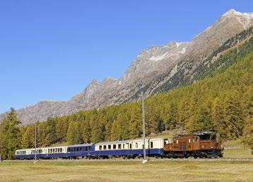 Zugskreuzung beider Bernina-Kompositionen in Bernina Lagalb. Der gelbe «Bellavista-Express» trifft in Bernina Lagalb ein. Der Pullman-Express wurde vom «Krokodil» Ge 6/6 415 gezogen.
