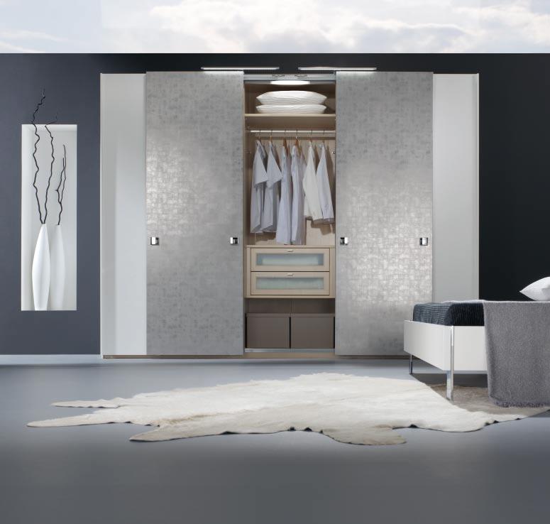 AVIANO and its extraordinary faux cubic-silver sliding doors prove that storage space can be light and elegant.