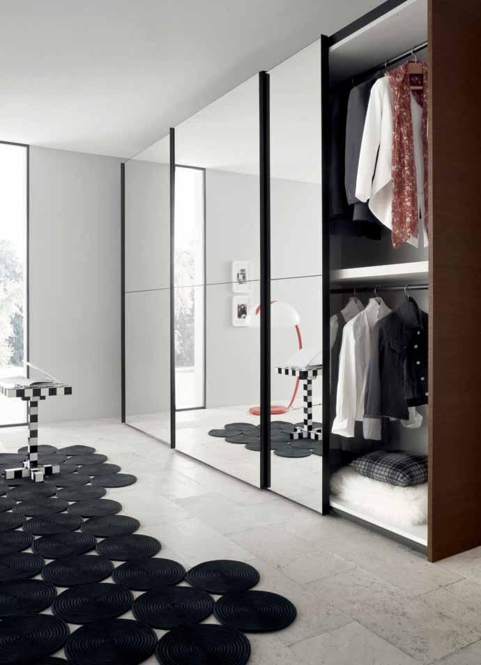 _ THE DESIGN OF THE REFLEX DOOR ENTAILS THE SLIDING MODE FOR OPENING AND CLOSING, AS IT DEFINITELY TURNS OUT PRACTICAL FOR ROOM ORGANISING, THAT IS EXPAND BY THE MIRROR FINISH OF THE DOORS.