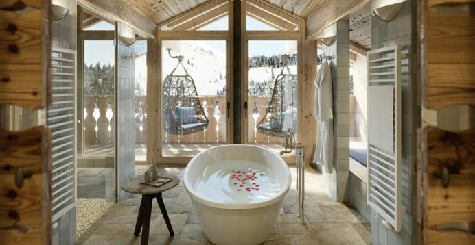stibitzen und sich auf ein heißes Wohlfühlbad in der separat installierten Badewanne des spektakulären Badebereichs zu freuen, welcher mit einem weiten Blick nach draußen verwöhnt.