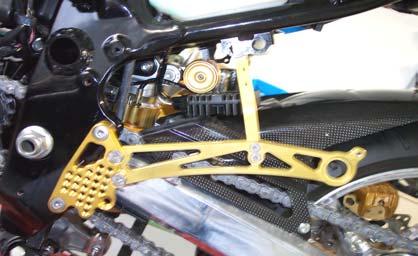 B Remove original rearsets. Detach rectifier of frame. Remove holder plate (A) and rubber sleeve (B) from frame.