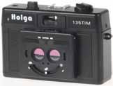 Holga 120n-G / 135 Tm (3d) / 135 tlr Kultige Plastikkamera für Profifilme im 60 mm breiten Rollfilmformat 120. Entfernungseinstellung ab 1 m ganz simpel über Symbole.