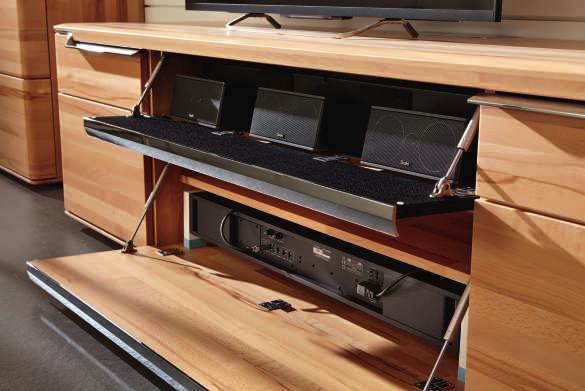 This combination consisting of a lowboard and the respective add-on unit focuses on the effect of the structured beech, in order to provide the required space for entertainment electronics.