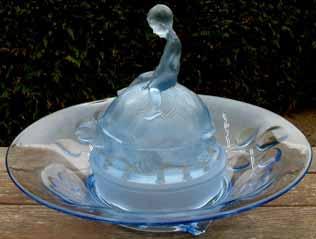 .. Blue Satin Glass... bowl decorated with flower pattern.