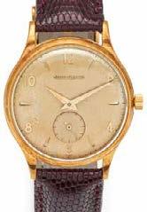 Uhren Uhren 247 JAEGER LECOULTRE Herrenarmbanduhr. Schweiz. Um 1960. Handaufzug. 750/- Gelbgold, Lederband bordeaux, Dornschließe (Doublé), Zffbl. lackiert, bedruckt, Zeiger/Indizes golden.