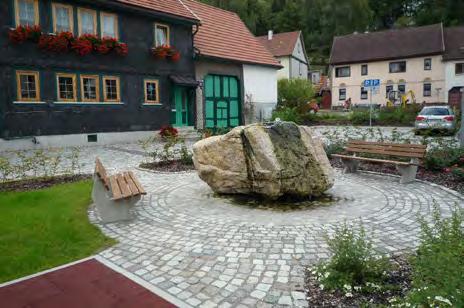 Neugestaltung der Fläche als  Steinbrunnen