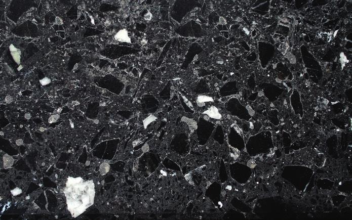 Kohlenkalk Karbon 340 Schwarzgrauer Kalkstein mit weißen Calcit-Adern Der Kalkstein entstand im Meer aus Faulschlamm von abgestorbenen Seelilien, Schalentieren und winzigem Plankton.