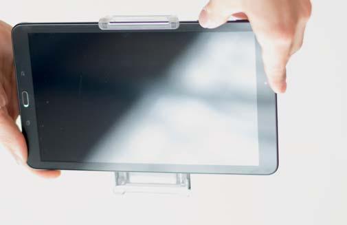 Now place your tablet (Android only) into the bottom of the holder first.