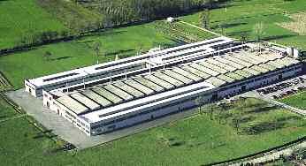THE COMPANY SAIT ABRASIVI S.p.A. DIE FIRMA SAIT ABRASIVI S.p.A. Coated Abrasive production facility. Produktionsstätte für die Herstellung von Schleifmittel auf Unterlage.