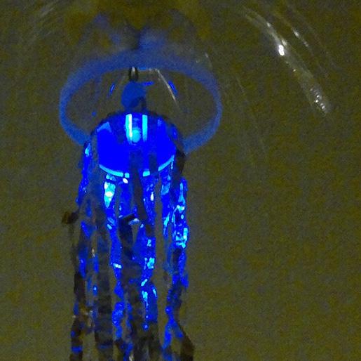 Plastic-waste- LED-Jellyfish The goal was creating simple Light objects from inspiring junk lying around the house. A blue LED, a 3V button cell and plastic parts where put together with thread.