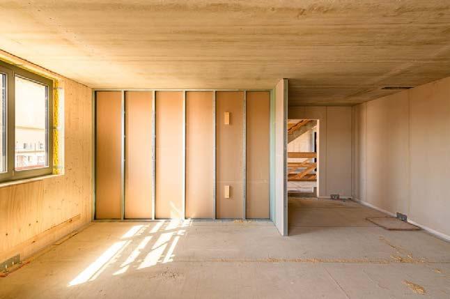 Schütt KG als Generalunternehmer errichtete das zweiteilige Gebäude mit offenem Treppenhaus und 15 Eigentumswohnungen in Holz-Hybrid-Bauweise.