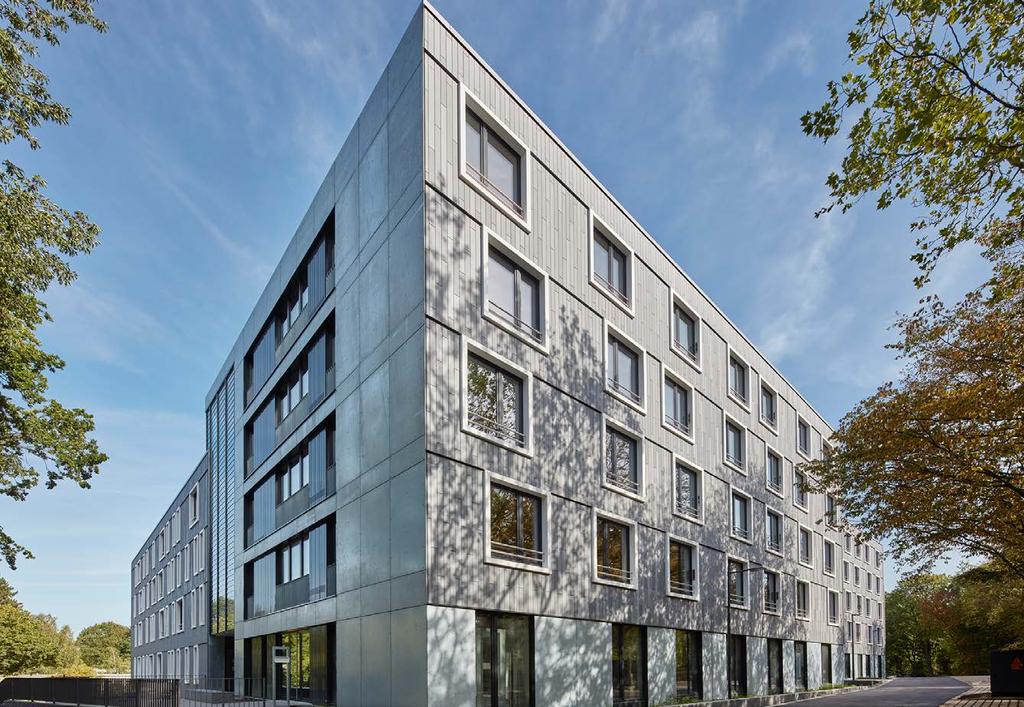 Wohnheim Bochum-Laerheide: Skelettbauweise aus einer tragenden SlimFloor-Konstruktion aus PEIKKO-DeltaBeams und BRESPA -Decken sowie nichttragenden Holzfassadenelementen Holz-Beton-Hybridbauten: