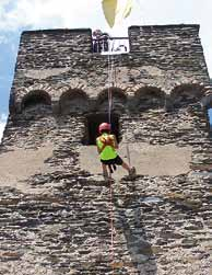 participants wear speciay-designed harnesses to descend the was of buidings face-down incuding the Steingassenturm in Oberwese standing at around 5 m.