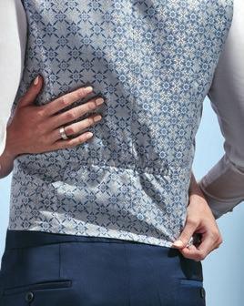 The pattern of the waistcoat is particularly innovative it is inspired by the Portuguese azulejos tiles.