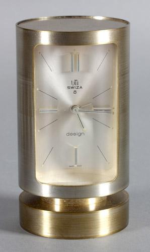 Katalog-Nr: 406 Wecker in Zylinderform, Schweiz, 1970er Jahre mechanisches 8 Tagewerk von UTI-Swiza, mattiertes Messinggehäuse und Zifferblatt, Zeiger und Balken auf 3,6,9 und 12 poliert, Uhr läuft,