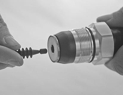 Push the corrugated seal manually into the cable centre conductor as shown.