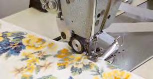 Precision work is carried out by cutting out the floating threads of the fabric.