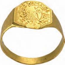 Antike Siegelsteine in moderner Ringfassung 951* Goldener Ring mit altorientalischem Siegelstein (sumerisch?) mit Darstellung einer springenden Capride mit zurückgewandtem Kopf.