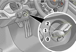 Öffnen der Abdeckung des 12 Volt Service Steckers im Beifahrerfußraum rechts. 2. Service Stecker entriegeln 1.