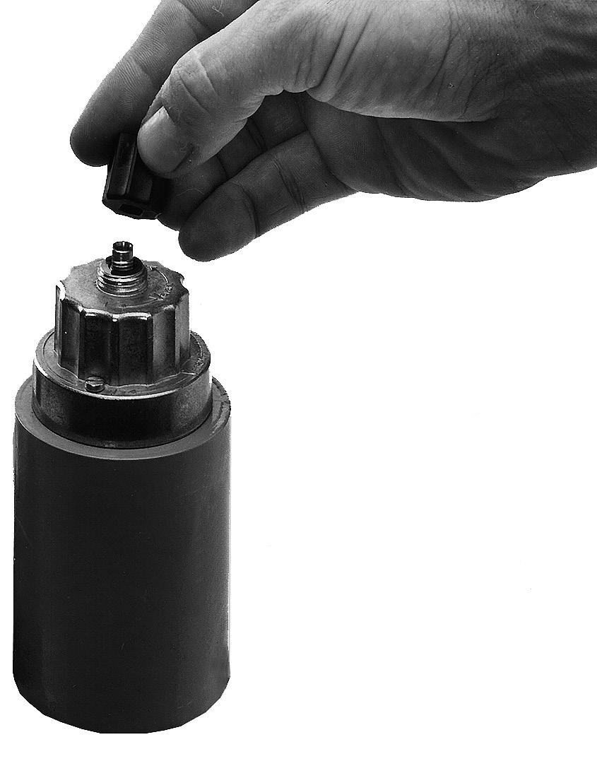 Unscrew the adjustment cap Efrom the hydraulic brake.. Turn the adjustment cap and use as a tool.