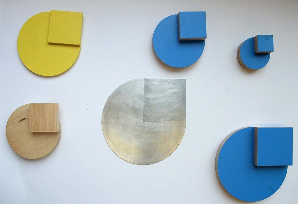 Kreisscheiben aus unterschiedlichen Materialien und zugehöriges Radiusquadrat (selbstgemacht,