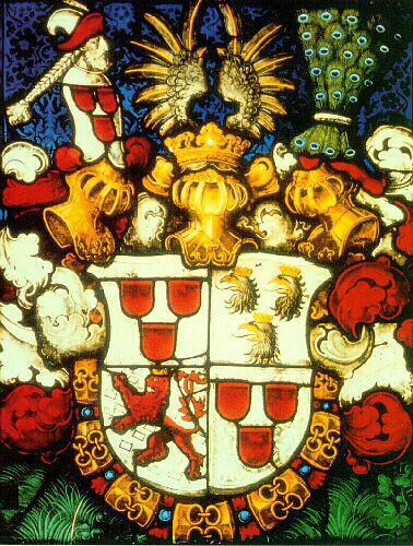 goldbekrönter, aufrecht schreitender roter Löwe mit Doppelschweif auf silbernem Grund mit blauen, schräg verstutzen Schindeln belegt drei