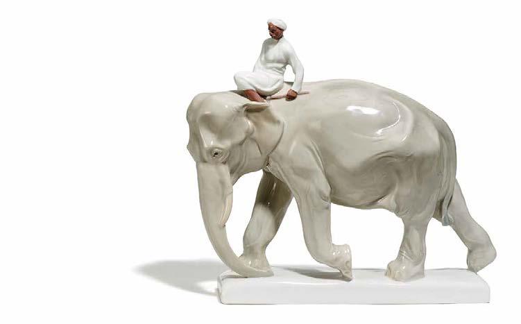 500-5.000 $ 4.860-5.400 1252 ELEFANT MIT INDER. PORCELAIN FIGURE OF AN ELEPHANT WITH AN INDIAN. Meissen. 1924-34. Modell P. Walther, 1906.