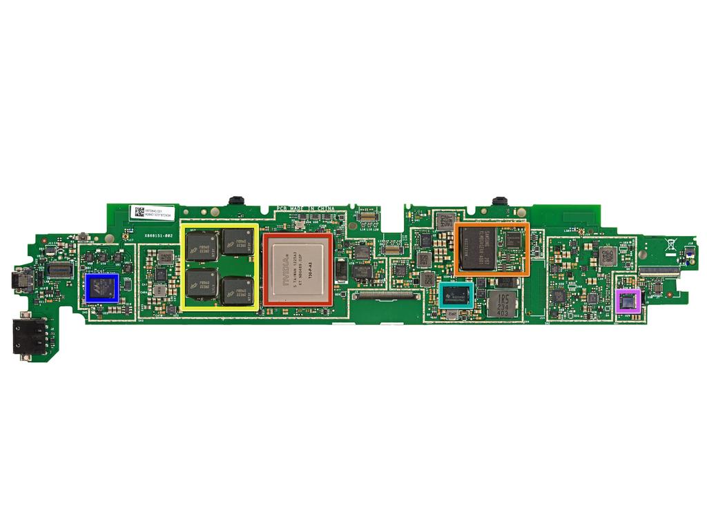 Schritt 14 Prominent ICs auf der Unterseite des Motherboards: NVIDIA 1,4 GHz Tegra 3 Processor Samsung KLMBG4GE4A 32 GB NAND - Flash (links) und Atmel UC3L Mikroprozessor (oben rechts).