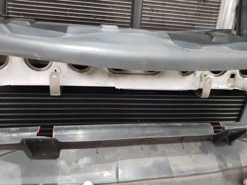Cut the lower air baffle at the position of the WT brackets so the air baffle lies flat against the WT intercooler.