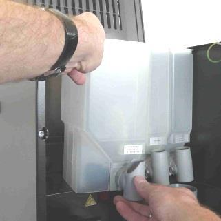 Das Füllen der Behälter muss außerhalb des Automaten erfolgen. Um das Herausnehmen der Behälter zu erleichtern, kann der Deckel des Automaten hochgeklappt werden (nach dem Öffnen der Tür).