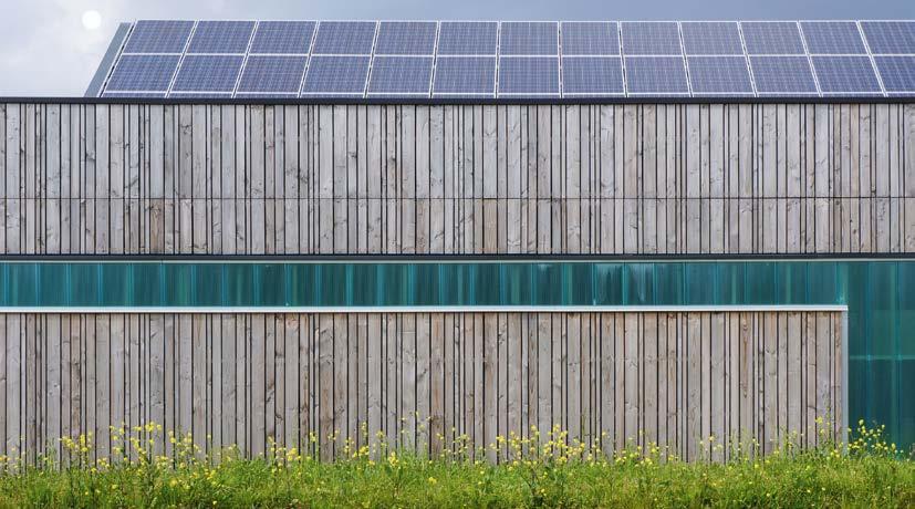 25 Abgrenzung der Umweltwirtschaft und Erfassungsmethodik Moderne Fassadengestaltung mit Holz und Glas sowie integrierter Fotovoltaikanlage.
