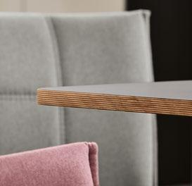 Their straight-lined decorative stitching looks classically elegant alongside the chamfered freeform table