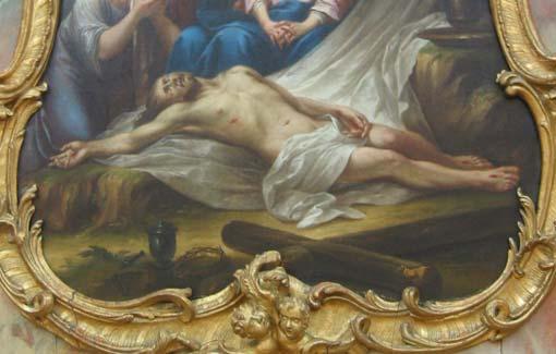 Über seinen Kopf gebeugt kniet die weinende Maria Magdalena, hinter ihr steht der betrübt blickende Johannes.