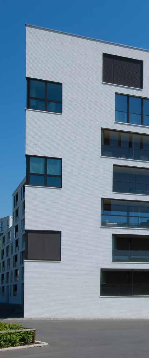 Referenzobjekt Mit mehrfachen Knicken in der Fassade reagieren die siebengeschossigen Baukörper der Wohnüberbauung Schutzengel auf den Strassenverlauf.