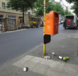 Abbildung 2 zeigt eine Bildvorlage mit fünf Mängeln, das heißt eine sehr schmutzige Straßenszene.