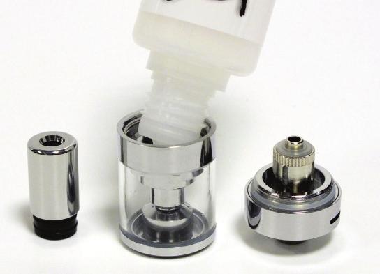 Using your arc Mini To fill the tank: Remove the complete CS Micro Tank from the arc Mini battery by unscrewing at the atomizer base. Invert the tank, unscrew and remove the atomizer base.