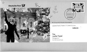 Ganzsachen-Umschlag Menschen erreichen Unter dem Motto Menschen erreichen hat die Deutsche Post AG die abgebildete Ganzsache versandt. Der Umschlag enthält Karten zum Thema Schöne weiße Weihnachten.