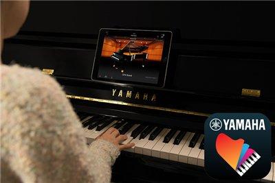 Die App Smart Pianist (erhältlich als kostenloser Download) bietet Ihnen Funktionen wie die Auswahl von