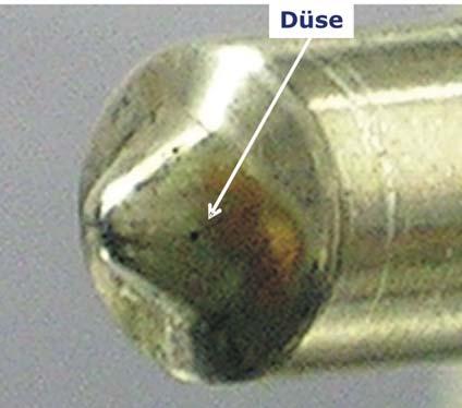 1.8 Abbildung 7a: Diesel-Einspritzdüse der DSLA-Serie von Bosch. Der Düsendurchmesser beträgt 260 µm Abbildung 7b: Messung der Strömung der Diesel- Einspritzdüse.