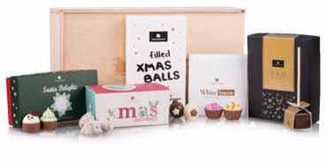 CHRISTMAS PRESENT SETS NEW 8450 Eine weihnachtliche mit einer Schleife dekorierte Schachtel mit überraschendem